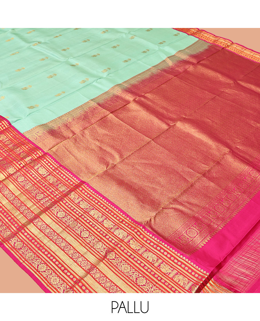 Turquoise Vasundhara Silk Saree, Embellished with Zari Buttas All Over Its Body, Complemented by a Contrast Border of Thilakam Mokku, Yaanai, Iruthalai Pakshi, and Kodi Visiry Designs, Grand Pallu, and Paired with a Contrast Blouse