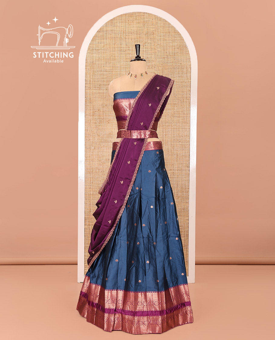 Blue and Purple Semi-Banarasi Half-Saree Featuring Zari Buttas Skirt, Complemented by Contrast Rettai Pettu, Traditional Border of Floral Creeper Designs, Paired with a Matching Blouse, and a Satin Georgette Embroidered Scallop Dhavani