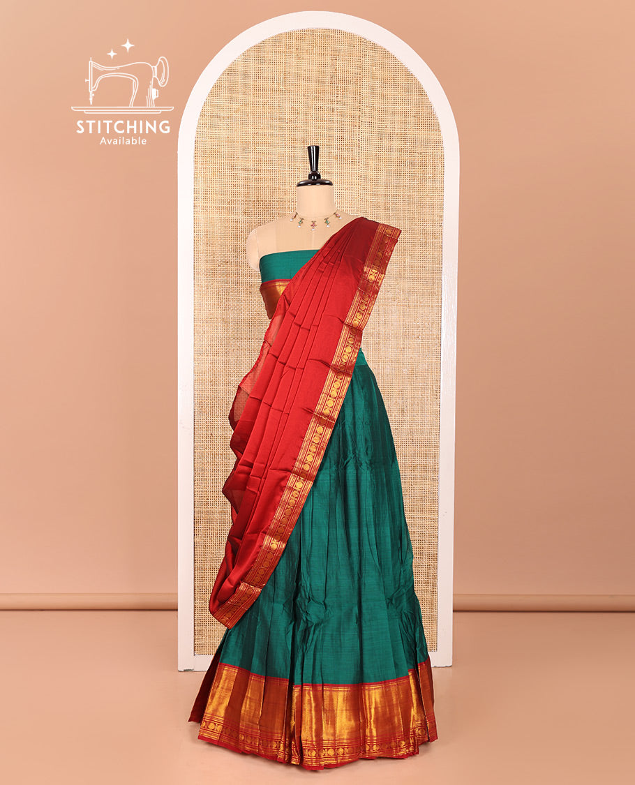 Green and Red Mercerised Cotton Half-Saree Featuring Plain Skirt, Adorned with a Contrast Peacock Eye-Rudraksham Motifs Woven Zari Border, Paired with a Matching Blouse, and Contrast Syska Georgette Dhavani with Zari Border