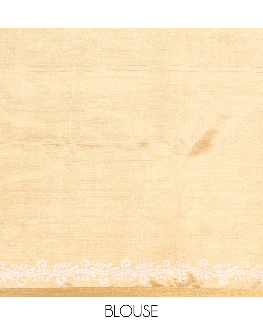 Gold geometric batik printed banana pith saree, printed piping border, paisley motifs steeped pallu, and a matching blouse