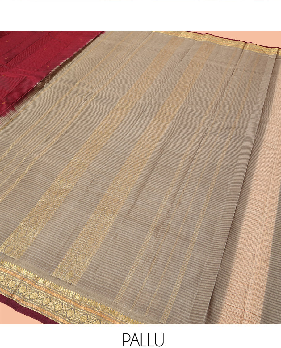 Maroon Kanchipuram Silk Saree Beautified with Vazhaipoo Stripes and Zari Buttas, Complemented by Contrast Border Featuring Manga Mokku, Muthu, Greek Key, and Laddu Kamalam Designs, Sparsely Zari Woven Pallu, and Paired with a Contrast Blouse