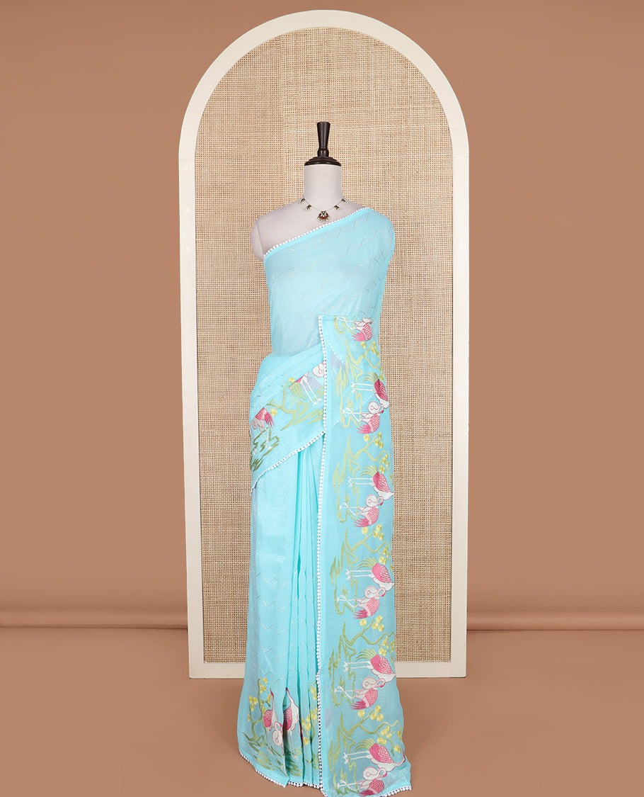 Blue chevron striped and flamingo motifs designer saree, pom-pom lace border, and chevron striped pallu