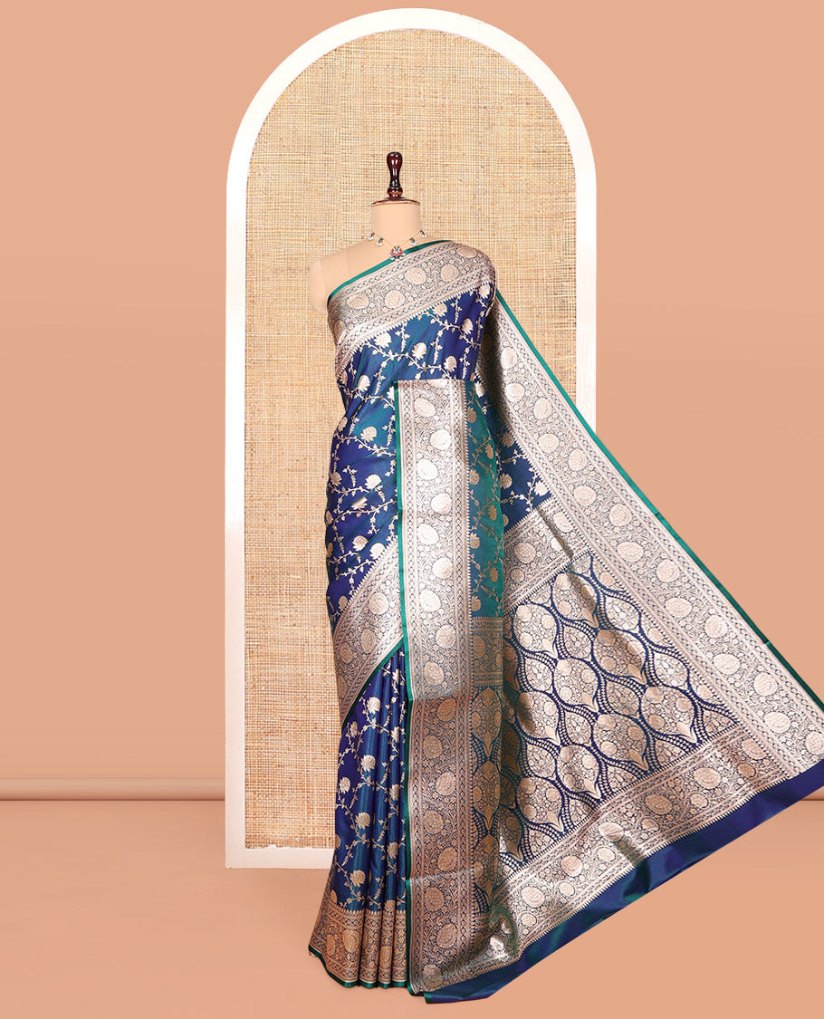 Peacock Blue Banarasi Nylon Saree, Uniquely Detailed with Jacquard, a Floral Creeper Zari Border, Intricate Pallu, and a Matching Blouse
