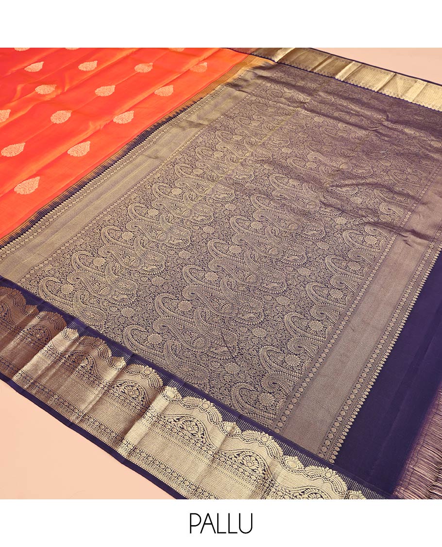 Orange Vasundhara Silk Saree Featuring Zari Buttas, Contrast Traditional Zari Border, Pallu Steeped with Paisleys, and Contrast Blouse