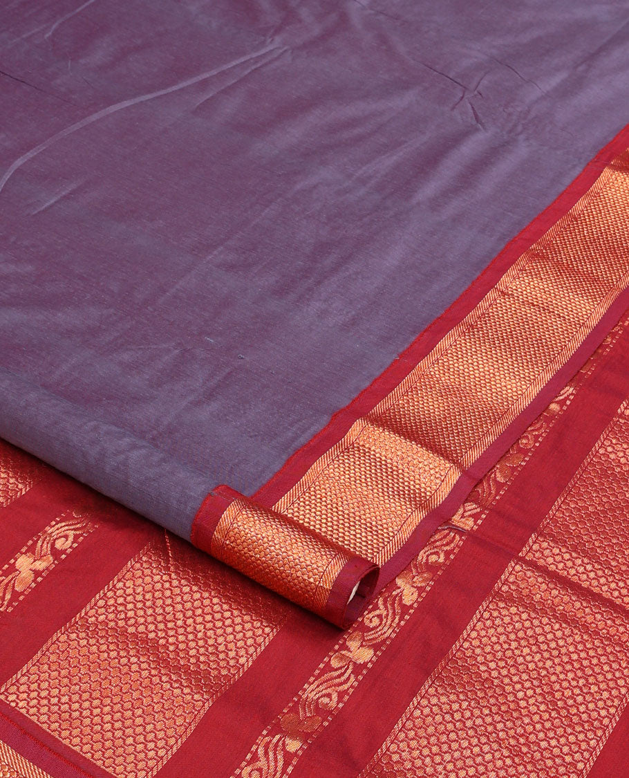 Purple plain nine-yard cotton saree, contrast traditional zari border, and pallu of traditional designs