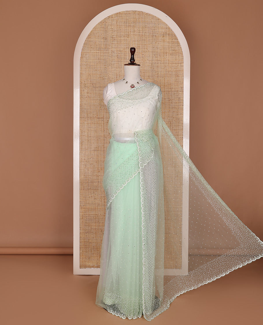 Pista green crystal stone & pearl beads embroidered designer saree with scallop embroidered border