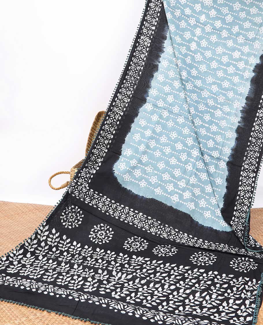 Light blue floral design mul mul cotton saree with contrast batik style border & batik style floral design pallu