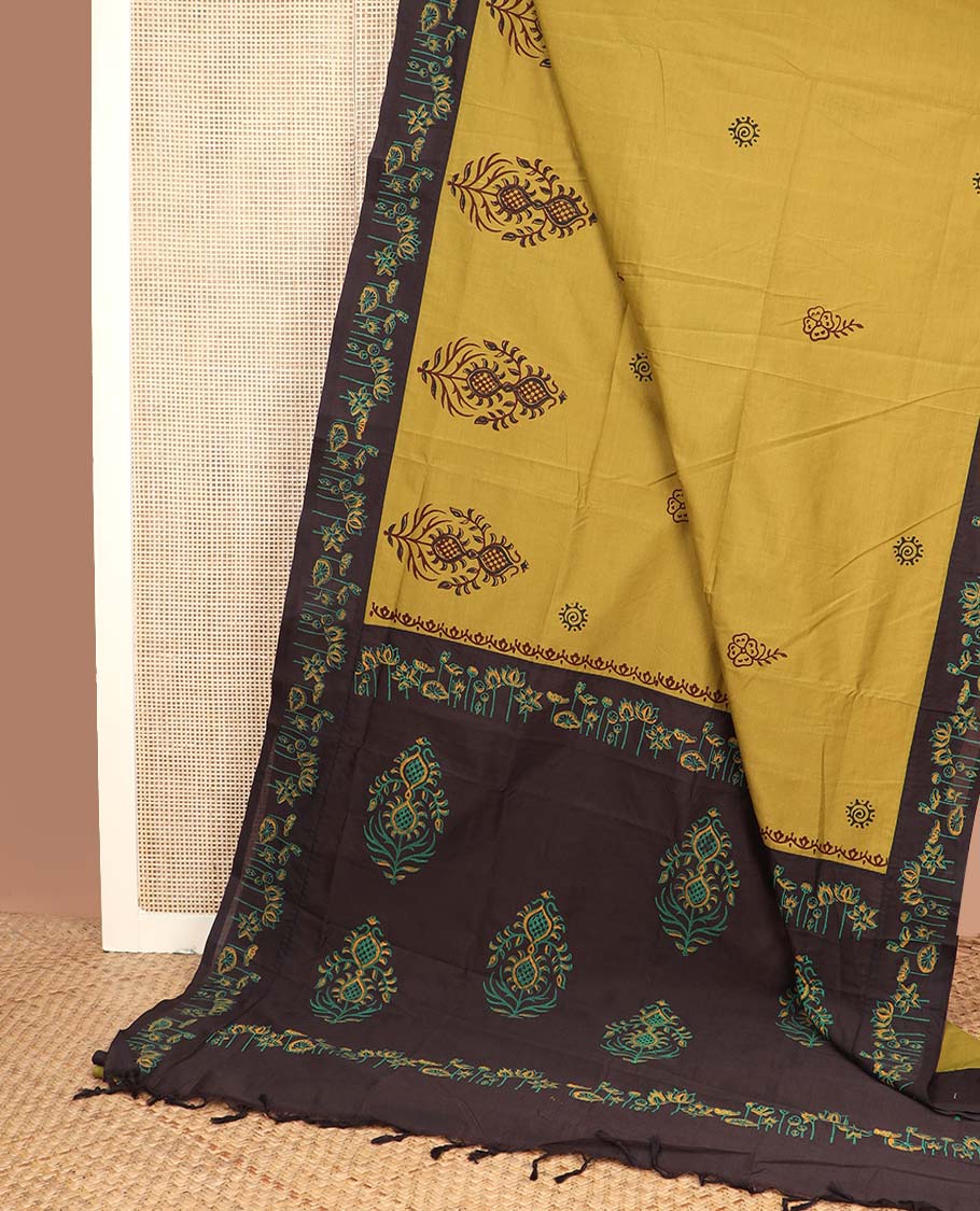 Yellow unique motifs printed poly cotton saree, contrast floral motif block printed border, and block printed motif pallu