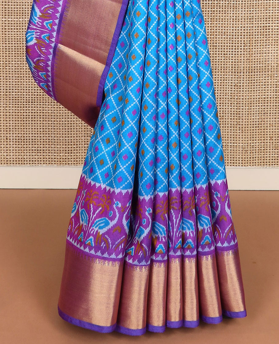 Blue buttas enclosed jaal patola silk saree, contrast temple zari border of swan motifs, and pallu of swan and diamond motifs