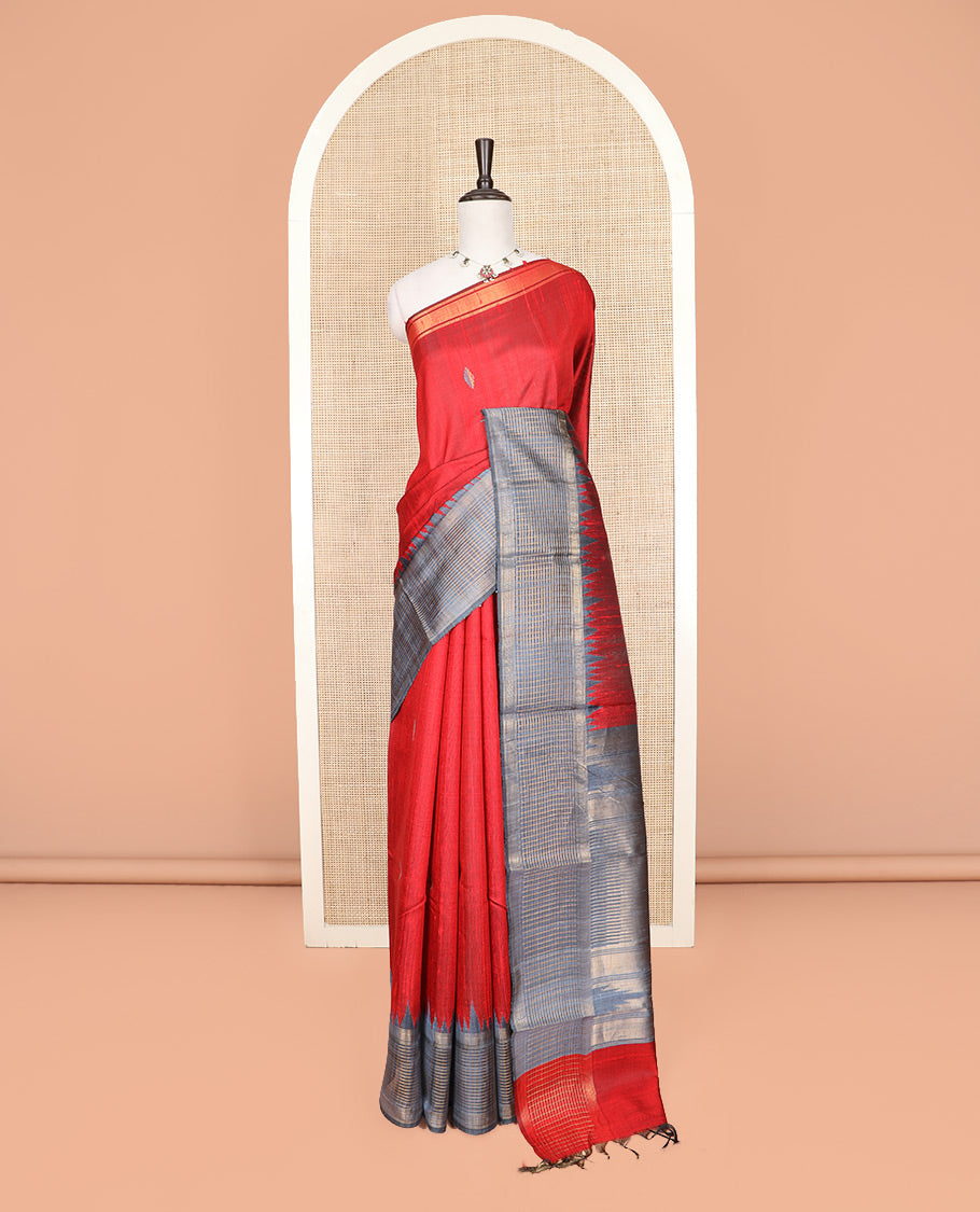 Red Dupion Silk Saree Featuring Geometric Buttas All Over Its Body, Highlighted by a Contrast Temple Border of Checked Patterns, Pallu Steeped with Zari Stripes, and Paired with a Contrast Blouse