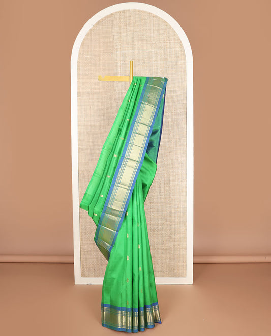 Green zari buttas kanchipuram silksaree, contrast one-sided border of paneer sombu,banaras,muthu & vanki & zari design pallu