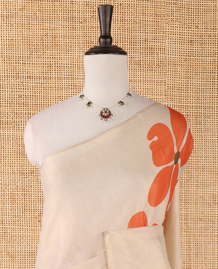 Borderless cream printed onam tissue silk saree features orange color five-petal flower & leaf motifs print, matching floral print blouse