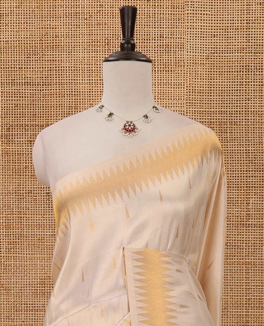Cream thilakam motifs banarasi tissue saree, zig-zag gold zari border, zig-zag zari design pallu & running blouse