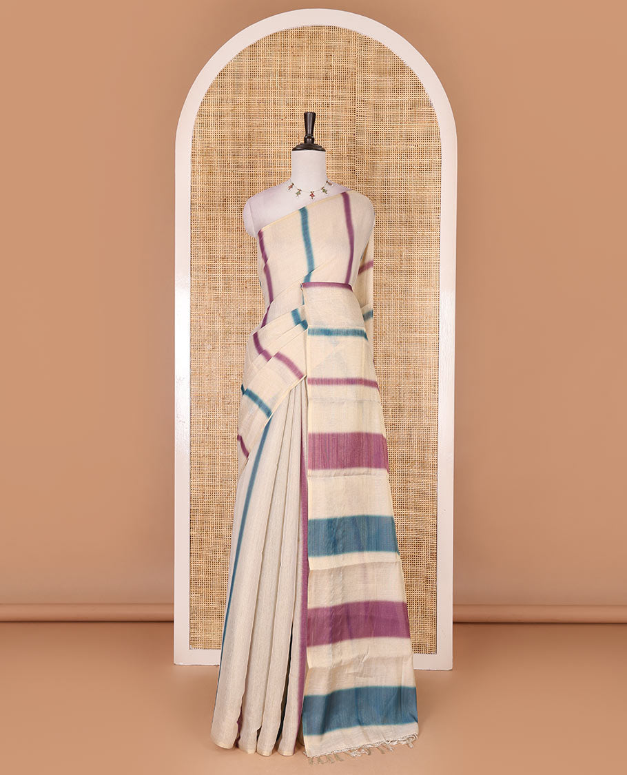 Borderless cream, colorful striped tissue saree, unique motifs printed blue color blouse