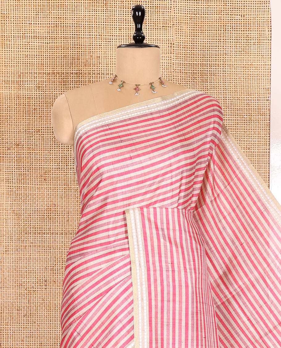 Pink Semi-Tussar Saree Featuring Horizontal Stripe Prints, Accentuated by a Subtle Resham Thread Temple-Designed Border, with a Pallu Highlighted by Intricate Circular Motifs, Paired with a Contrast Bandhani Blouse