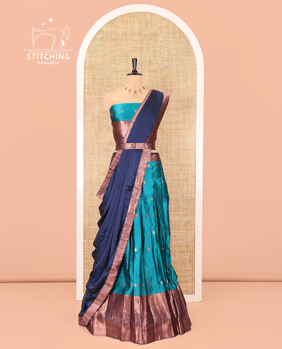 Rama-Navy Blue Semi-Banarasi Half-Saree Features Buttas on Skirt, a Contrast Traditional Zari Border, a Matching Blouse, and a Contrast Satin Georgette Dhavani