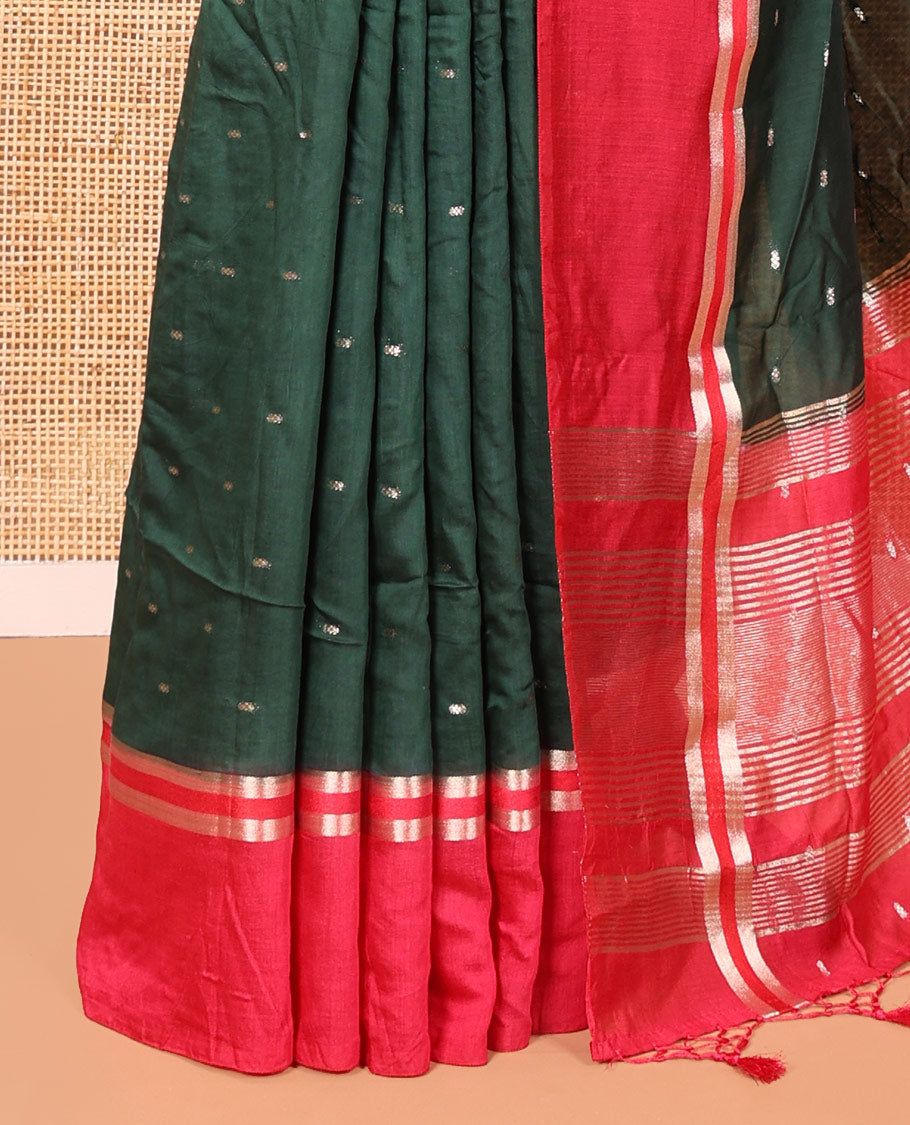 Bottle Green Assam Silk Saree, Accentuated with Zari Buttas on Its Body, Complemented by Contrast Zari Striped Border, Pallu Steeped with Gleaming Zari Stripes and Buttas, and Paired with a Contrast Blouse