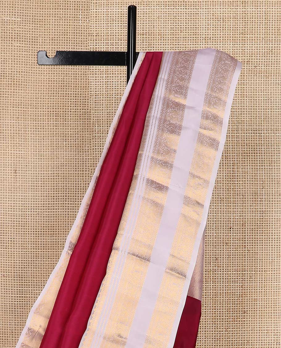 Red zari buttas Vasundhara silk mix saree, contrast border rettai pettu of thilakam, muthu, cross kamalam, neli, and mayil designs, and intricate pallu
