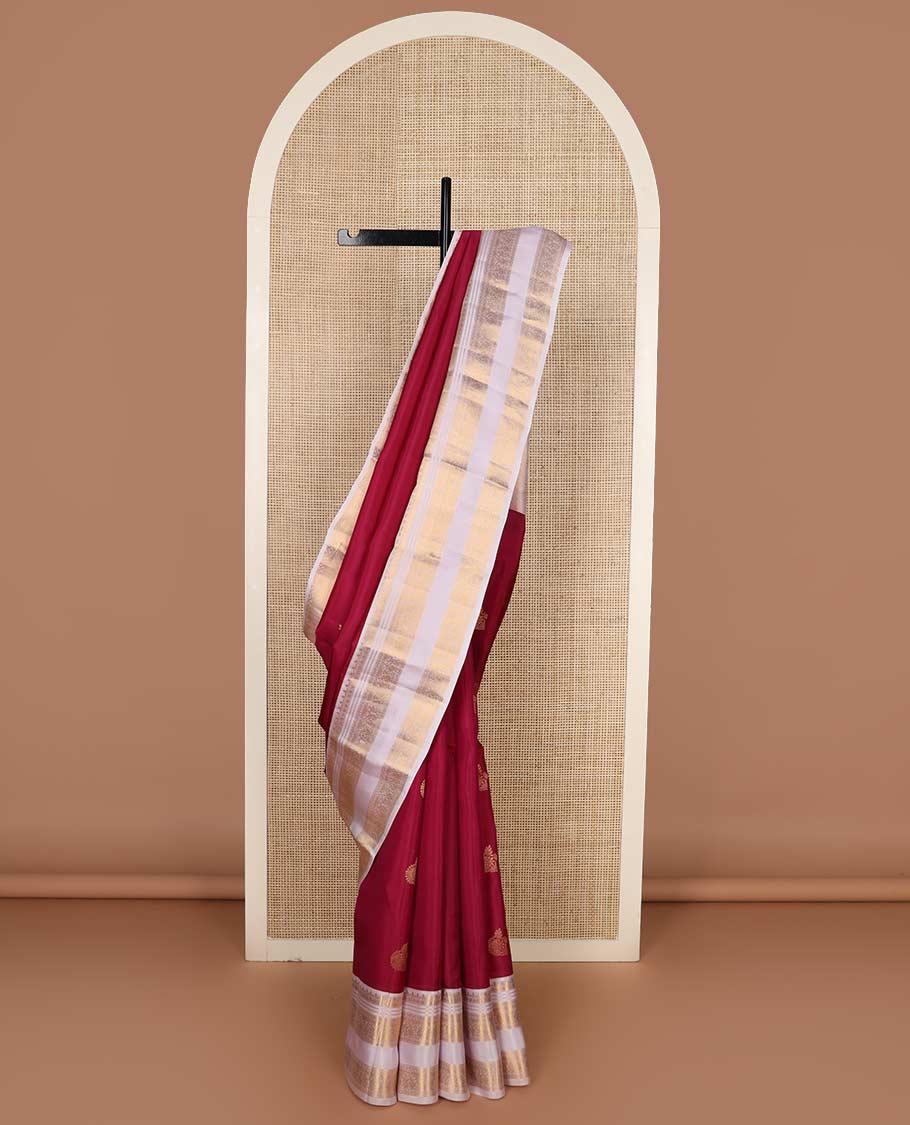 Red zari buttas Vasundhara silk mix saree, contrast border rettai pettu of thilakam, muthu, cross kamalam, neli, and mayil designs, and intricate pallu