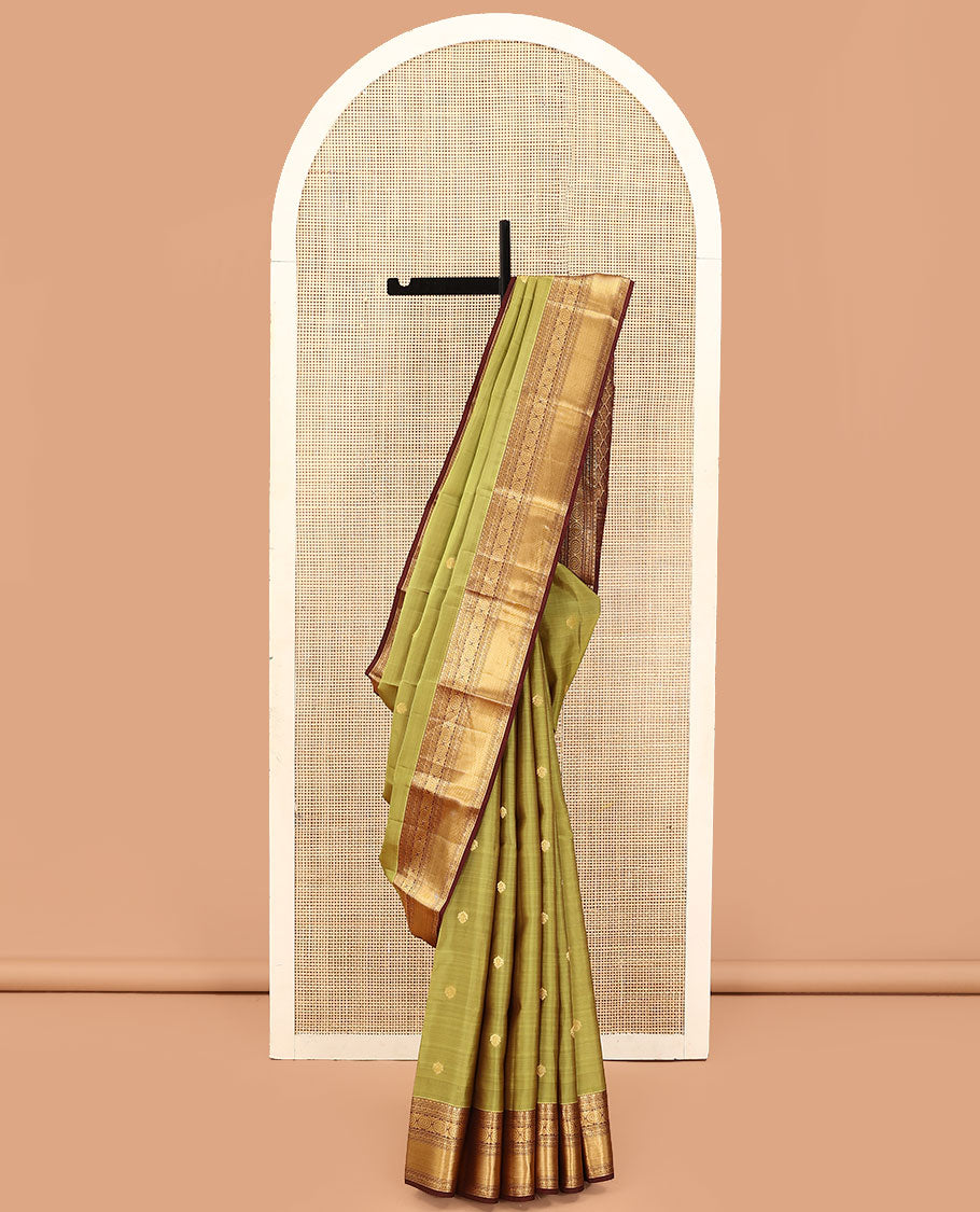 Green Vasundhara Lite Silk Mix Saree, Subtly Woven with Zari Buttas on Its Body, Complemented by a Contrast Border of Kodi Visiry and Chakram Designs, Pallu of Jaal Designs, and Paired with a Contrast Blouse