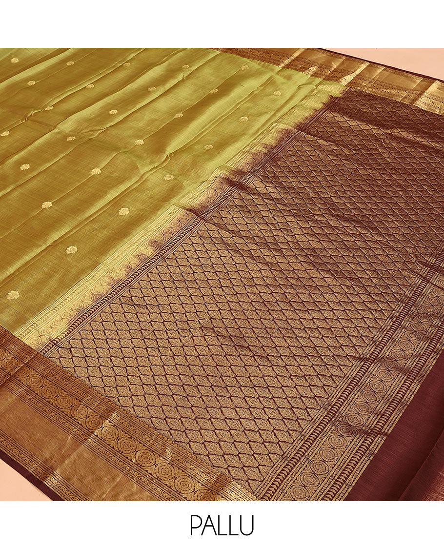 Green Vasundhara Lite Silk Mix Saree, Subtly Woven with Zari Buttas on Its Body, Complemented by a Contrast Border of Kodi Visiry and Chakram Designs, Pallu of Jaal Designs, and Paired with a Contrast Blouse