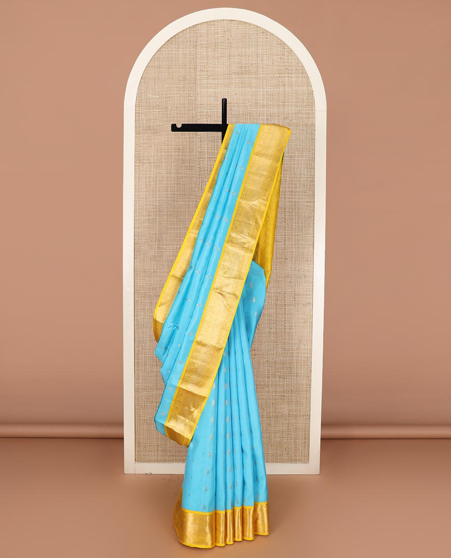 Blue zari buttas Vasundhara silk saree, contrast border of rekku, manga, chakram, mayil kann, and rudraksham designs, and intricate pallu