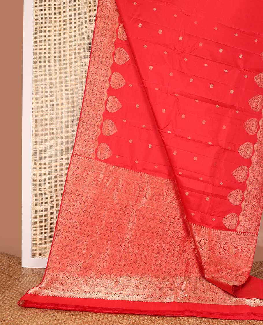 Red zari buttas silk saree, zari border and pallu of yanaai, diamond, chakram and mayil buttas enclosed checks