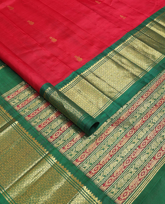 Red zari buttas Kanchipuram silksaree, contrast korvai one-sided border of thilakam mokku & mayil kann & pallu o kodi visiry