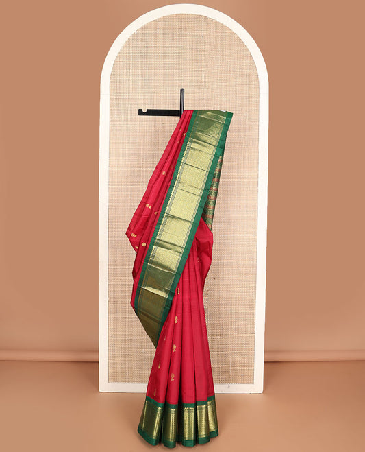 Red zari buttas Kanchipuram silksaree, contrast korvai one-sided border of thilakam mokku & mayil kann & pallu o kodi visiry