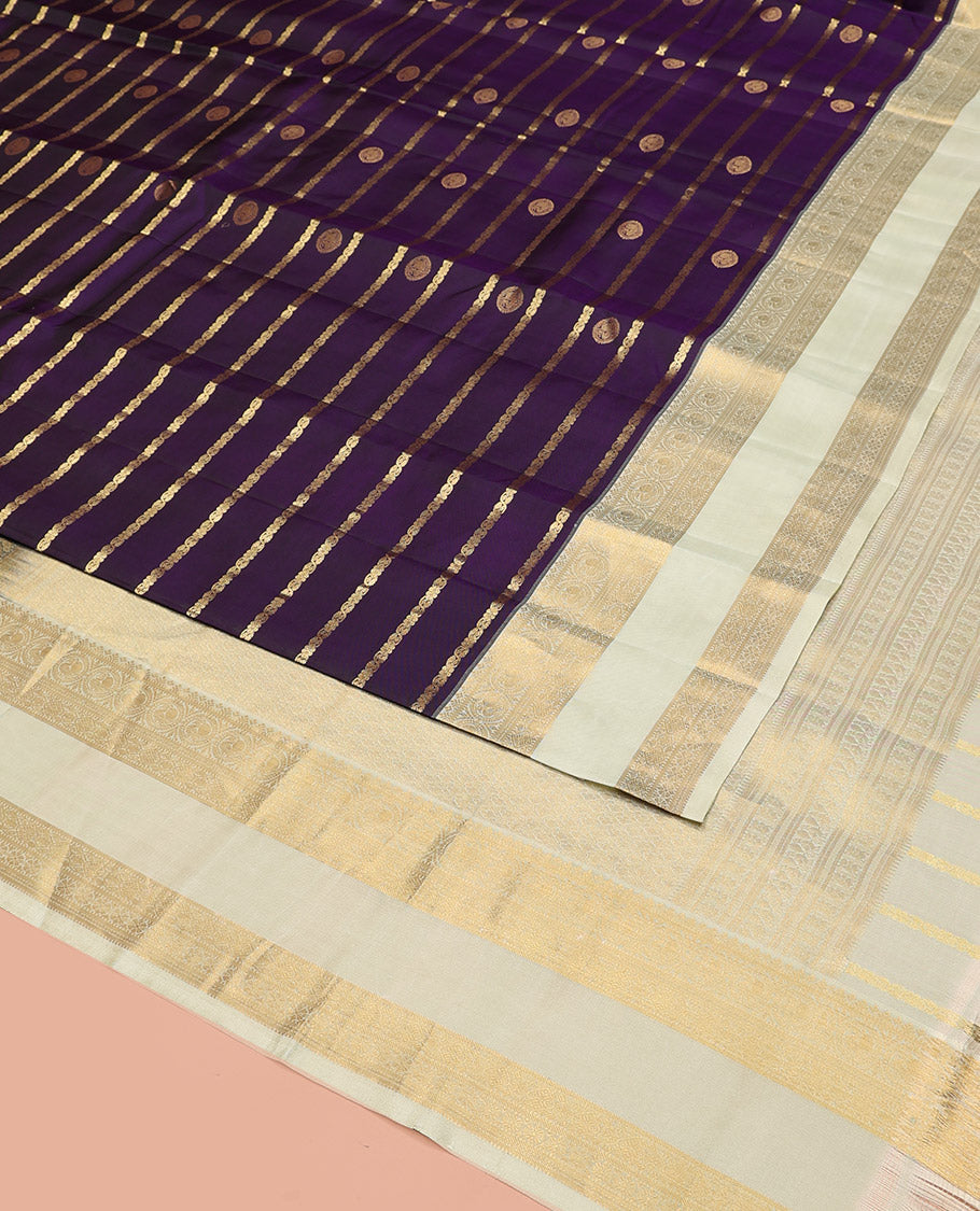 Purple Vasundhara Silk Saree Spotlighted with Zari Buttas and Zari Stripes All Over Its Body, Complemented by Contrast Rettai Pettu Border of Round Mayil Designs, a Grand Pallu, and Paired with a Contrast Blouse