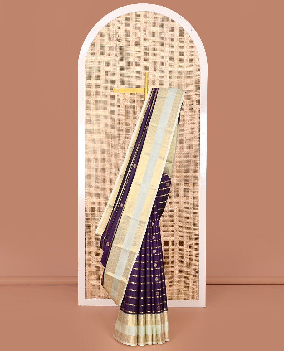 Purple Vasundhara Silk Saree Spotlighted with Zari Buttas and Zari Stripes All Over Its Body, Complemented by Contrast Rettai Pettu Border of Round Mayil Designs, a Grand Pallu, and Paired with a Contrast Blouse