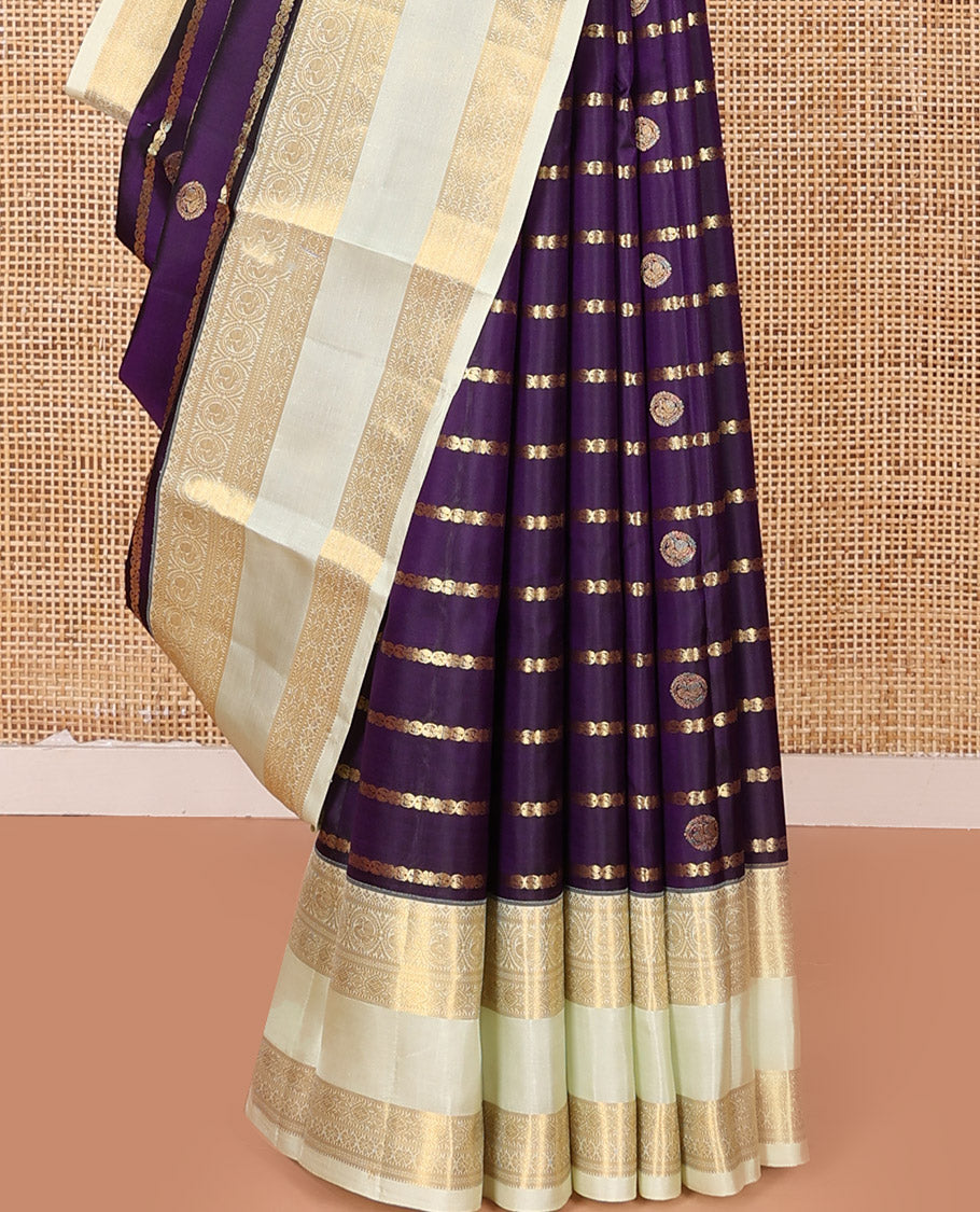 Purple Vasundhara Silk Saree Spotlighted with Zari Buttas and Zari Stripes All Over Its Body, Complemented by Contrast Rettai Pettu Border of Round Mayil Designs, a Grand Pallu, and Paired with a Contrast Blouse