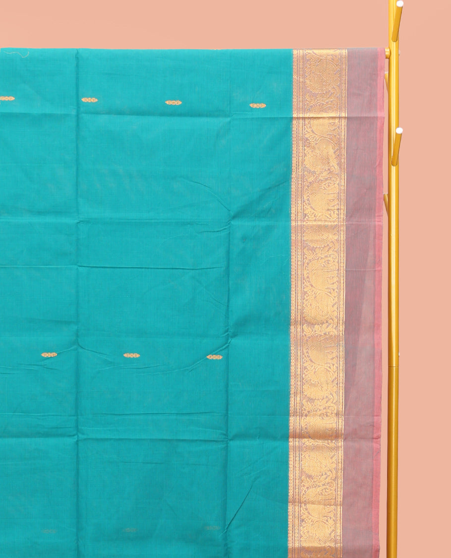 Blue Chettinad Cotton Saree, Bedecked with Thread Buttas All Over Its Body, Complemented by a Contrast Kal Eragina Border of Kodi Peacock and Elephant Designs, Pallu of Buttas and Stripes, and Paired with a Matching Blouse
