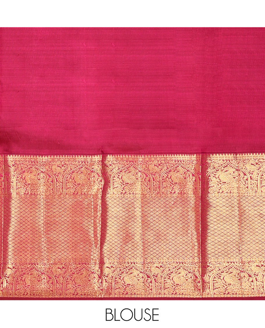 Purple Kanchipuram Silk Saree, Meticulously Crafted with Zari Buttas All Over Its Body, Highlighted by a Zari Border of Rekku, Paisa, Mayil, and Jaal Designs, Pallu of Ogee Patterns, and Paired with a Matching Blouse