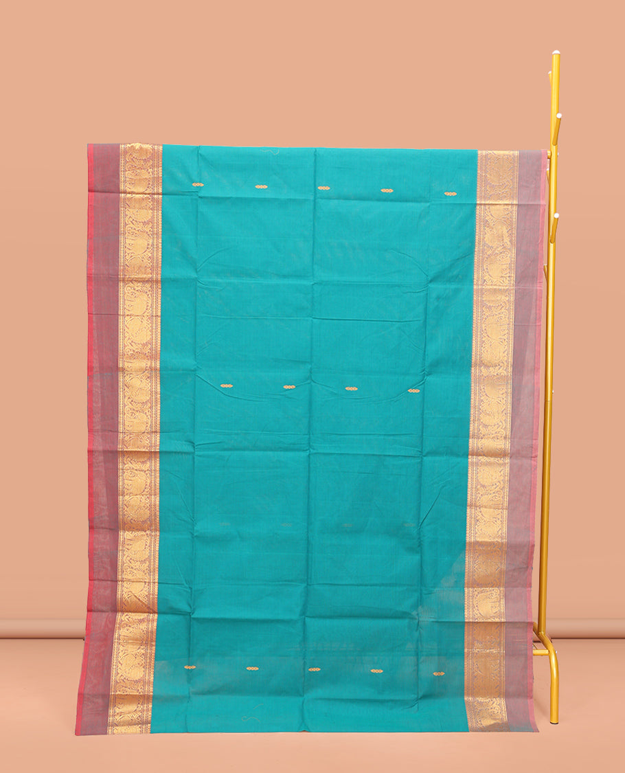 Blue Chettinad Cotton Saree, Bedecked with Thread Buttas All Over Its Body, Complemented by a Contrast Kal Eragina Border of Kodi Peacock and Elephant Designs, Pallu of Buttas and Stripes, and Paired with a Matching Blouse