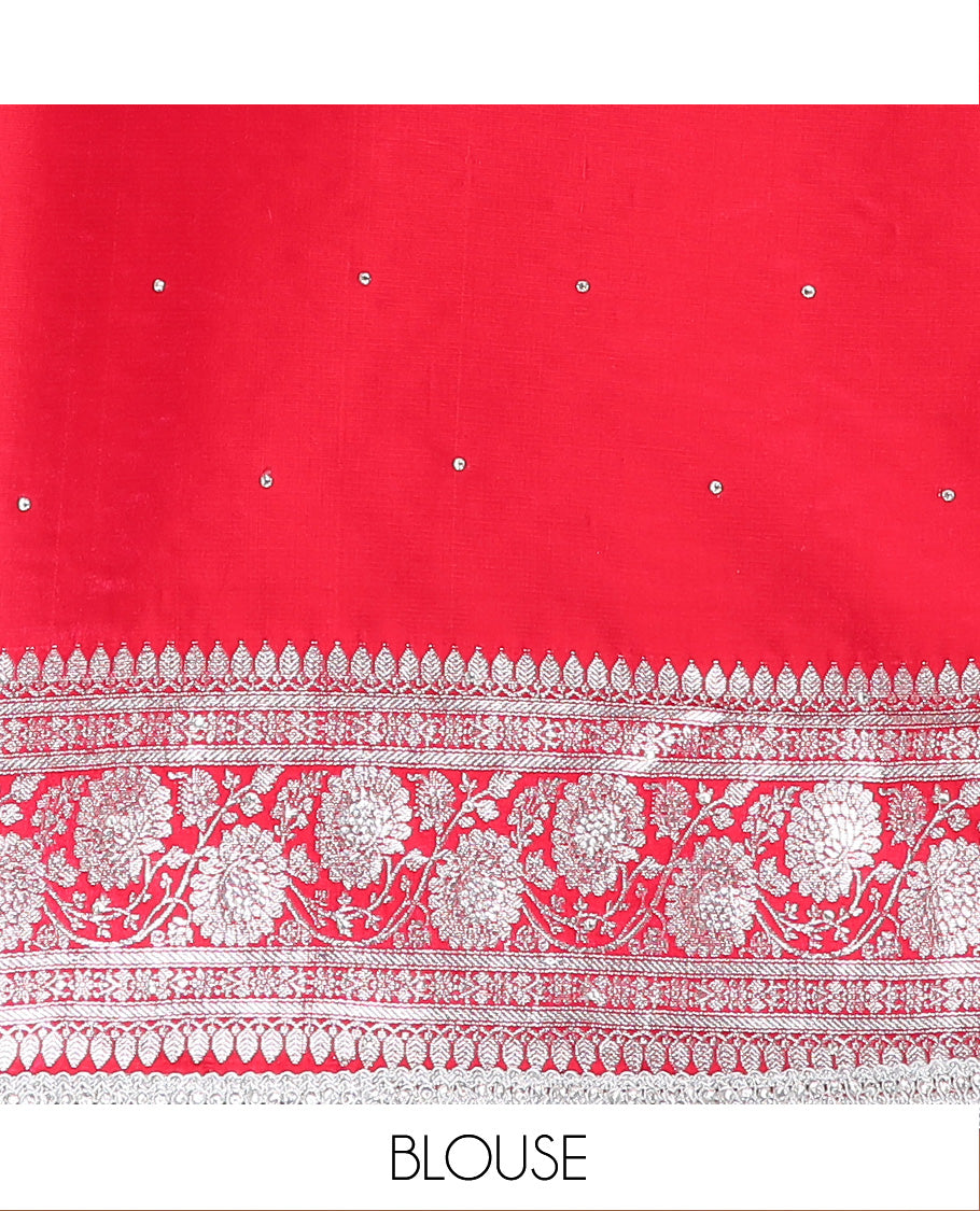 Orange Semi-Banaras Nylon Saree Highlighted with Floral Jaal Jacquard and Stone Work, Complemented by a Contrast Floral Creeper Zari Stone Work Lace Border, Floral Bouquets Themed Pallu Detailed in Zari and Stone Work, and Paired with a Contrast Blouse