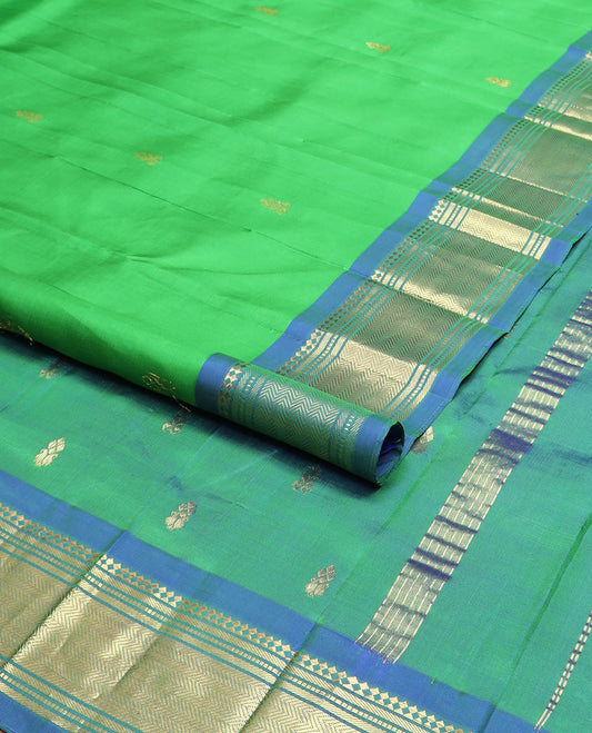 Green zari buttas kanchipuram silksaree, contrast one-sided border of paneer sombu,banaras,muthu & vanki & zari design pallu