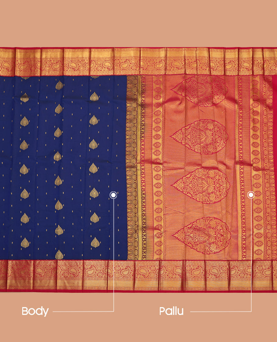 Navy Blue Budget Silk Saree, Adorned with Zari Buttas on Its Body, Complemented by a Contrast Traditional Zari Border of Paisleys, Intricately Designed Pallu, and Paired with a Contrast Blouse