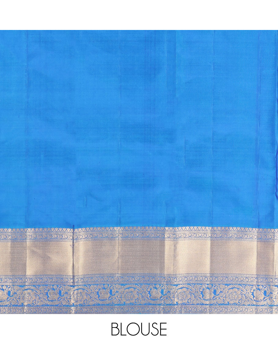 Blue Vasundhara Silk Saree, Mesmerized with Zari Buttas All Over Its Body, Highlighted by a Zari Border of Kodi Visiry, and Mayil Designs, Grand Jaal Pallu, and Paired with a Matching Blouse