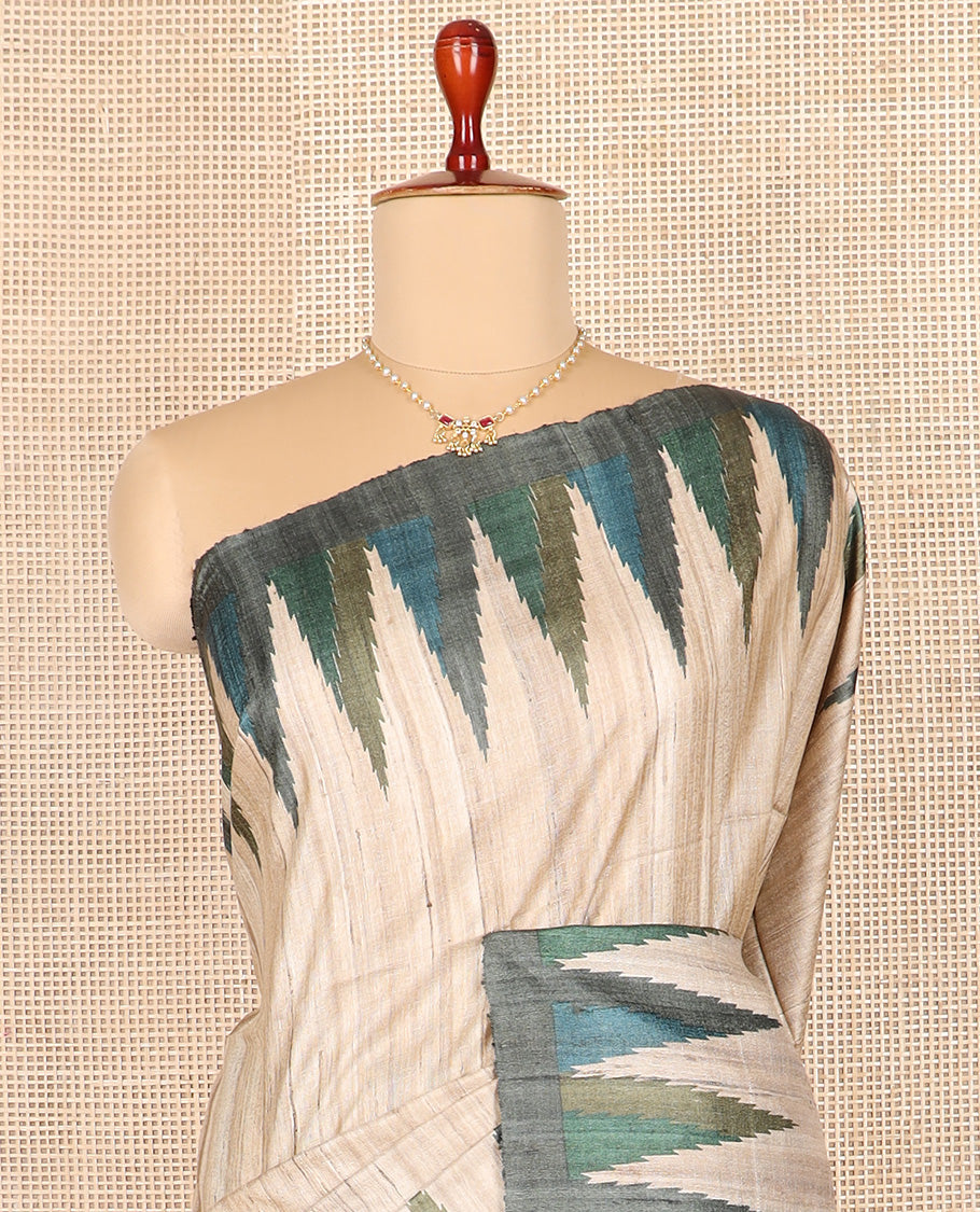Light sandal plain tussar saree, contrast temple border, and geometric patterned pallu