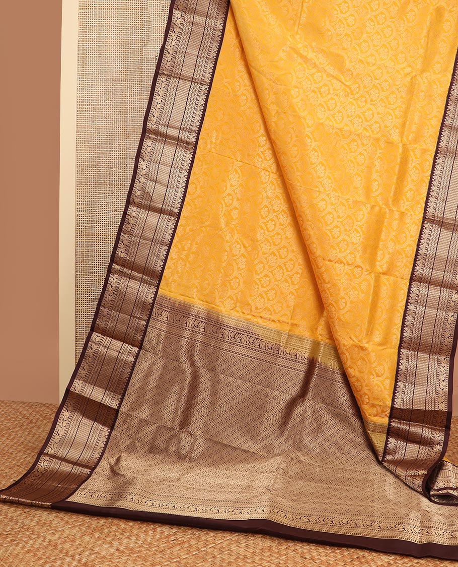 Orange floral jaal design kancheepuram silk saree with contrast border of thilakam mokku, banaras, muthu design & zari design pallu