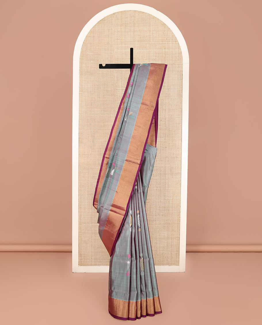 Grey Uppada Silk Saree, Elevated with Meena Buttas All Over Its Body, Complemented by Contrast Zari Bavanji Border, Captivating Contrast Pallu Steeped with Meena Buttas, and Paired with a Contrast Blouse