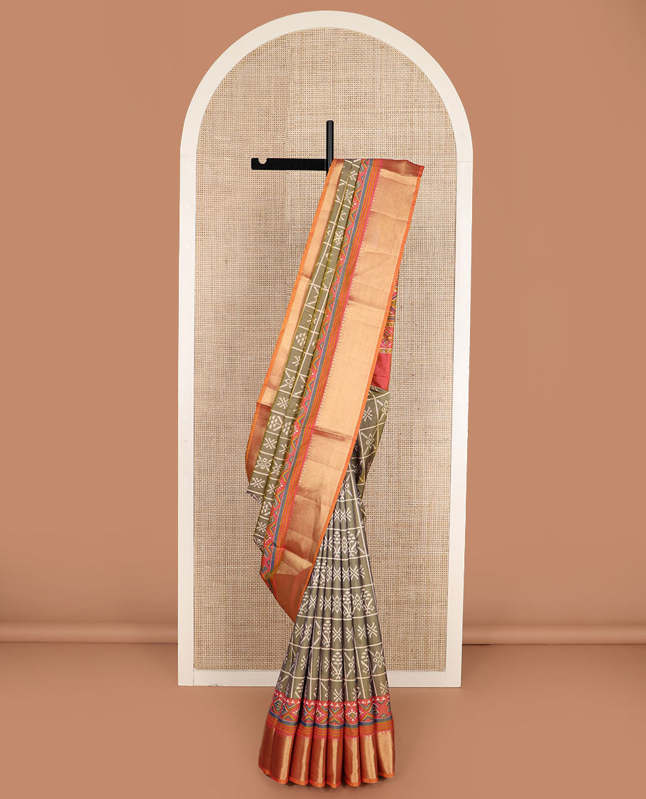 Green butta enclosed checked semi-banaras patola silk saree, contrast zari border of ikkat design, and pallu steeped with geometric patterns