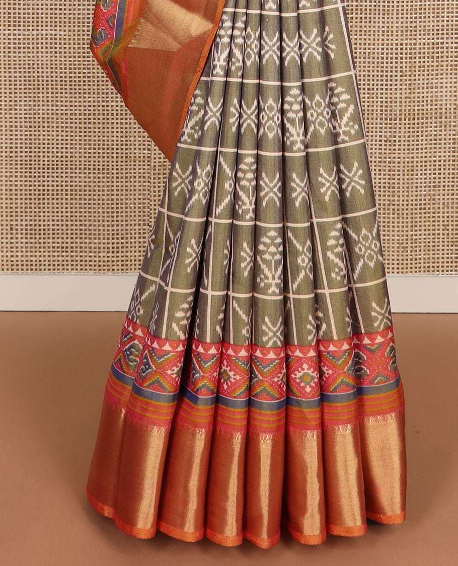 Green butta enclosed checked semi-banaras patola silk saree, contrast zari border of ikkat design, and pallu steeped with geometric patterns