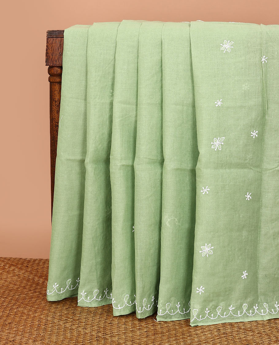 Elaichi green embroidered buttas Lucknowi chikankari saree, thread embroidered border, and floral-paisley motifs embroidered pallu