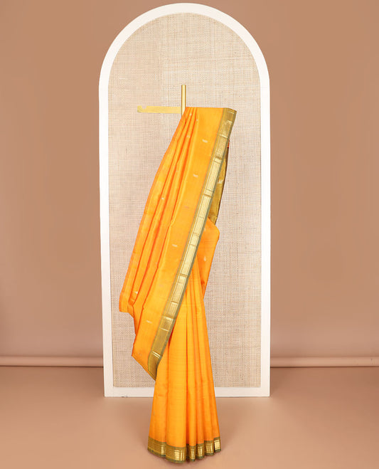 Yellow zari buttas kanchipuram silksaree, contrast one-sided border of banaras & mayil kann & zari design pallu