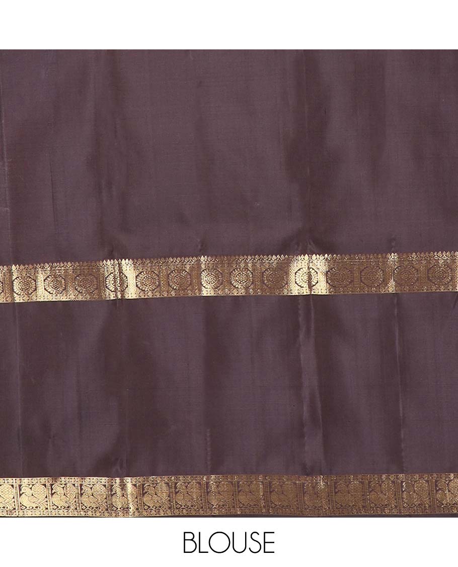 Orange micro-zari checked Kanchipuram silk saree, contrast rettai pettu border of thilakam mokku, rudraksham, and poo chakram and mayil designs, and buttas enclosed jaal pallu