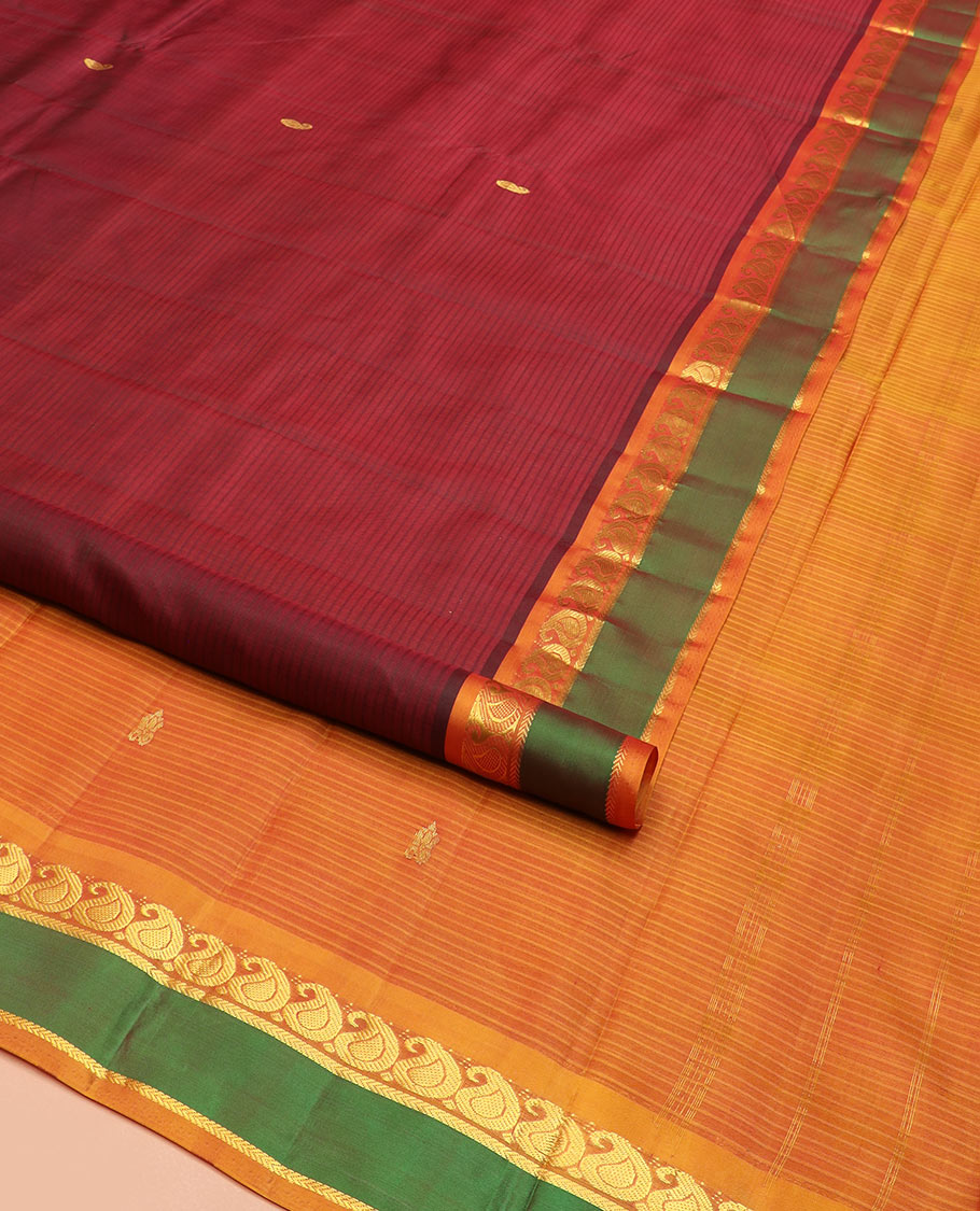 Maroon Kanchipuram Silk Saree Depicting All-Over Stripes and Manga Buttas, Complemented with Contrast Manga and Kathir Design Rettai Pettu Border, Pallu of Zari Designs, and Paired with a Contrast Blouse