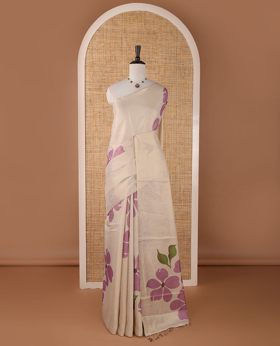 Borderless cream printed onam tissue silk saree features light lavender color five-petal flower & leaf motifs print, matching floral print blouse
