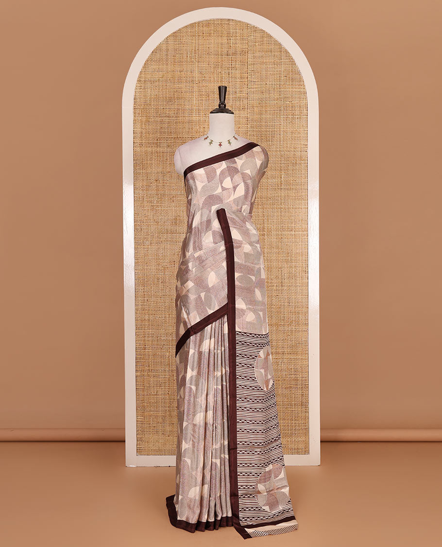 Beige geometric patterns printed Turkey crepe saree, contrast printed piping border, printed pallu, and printed blouse